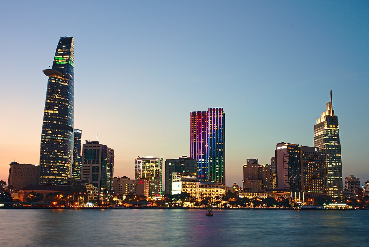 The Saigon River and central Ho Chi Minh City skyline at dusk, viewed from Thu Thiem